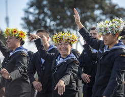 Royal New Zealand Navy sailors perform a Pacific Island dance at a Navy graduation ceremony 