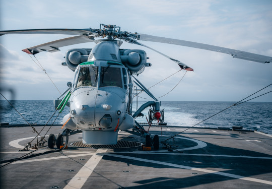 A Seasprite helicopter armed with a Penguin Missile sits on the flight deck of HMNZS Te Kaha.