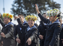 A Royal New Zealand Navy recruit performs a pacific islands dance at Graduation 