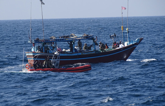 A boarding team from United States Coast Guard cutter Emlen Tunnell board a suspicious dhow in the Arabian Sea to seize and destroy 2357kg of hashish.