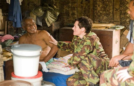 Captain Fraser completing a house call during a deployment to Tonga